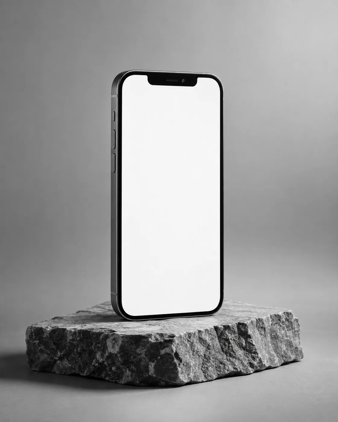 Celular em pé sobre uma pedra mostrando a página de uma clínica